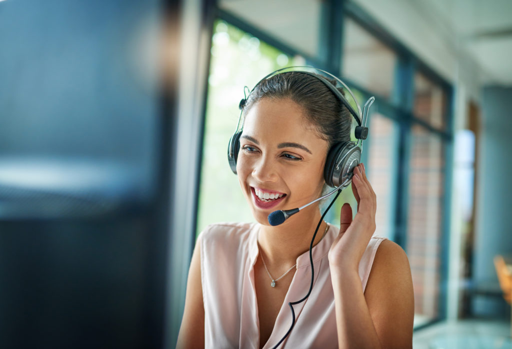 young businesswoman working customer support to convert prospects to customers